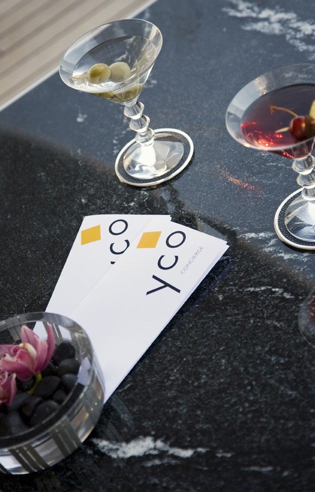 Y.CO concierge cards on black marble